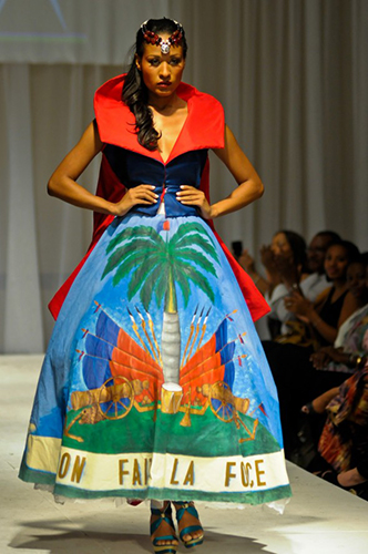 A model presents a creation by Haitian designer Verona during a runway show at Haiti’s first Fashion Week