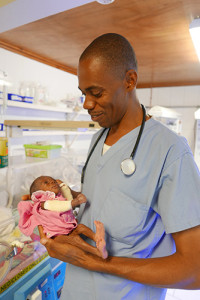HSC Pediatrician Dr. Exavier tends to one of his NICU patients